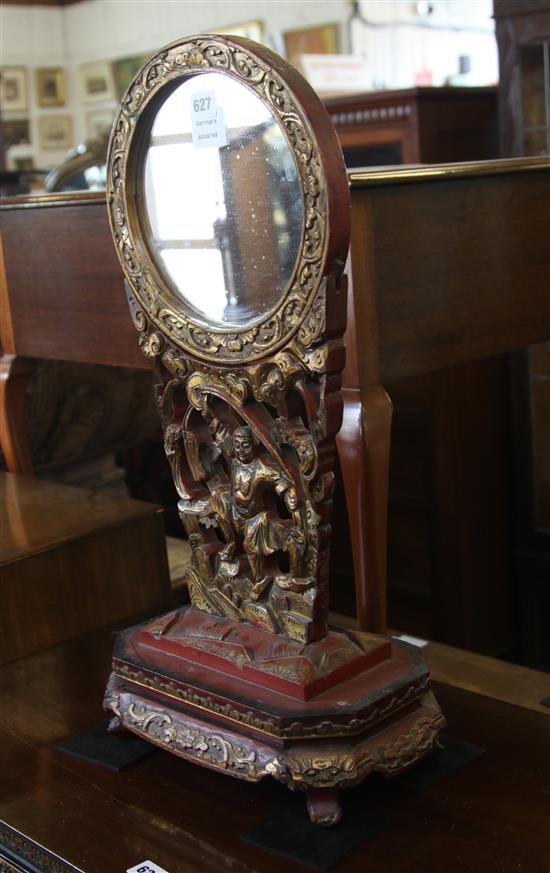 A Chinese red lacquer and gilt mirror